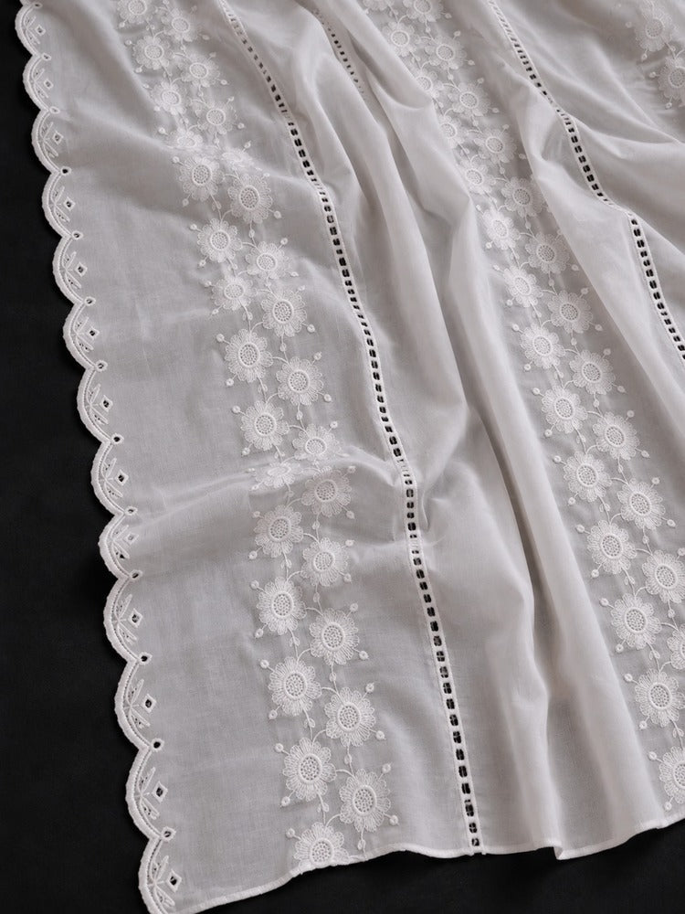 White shawl for women with delicate floral embroidery and scalloped lace edges on a dark background