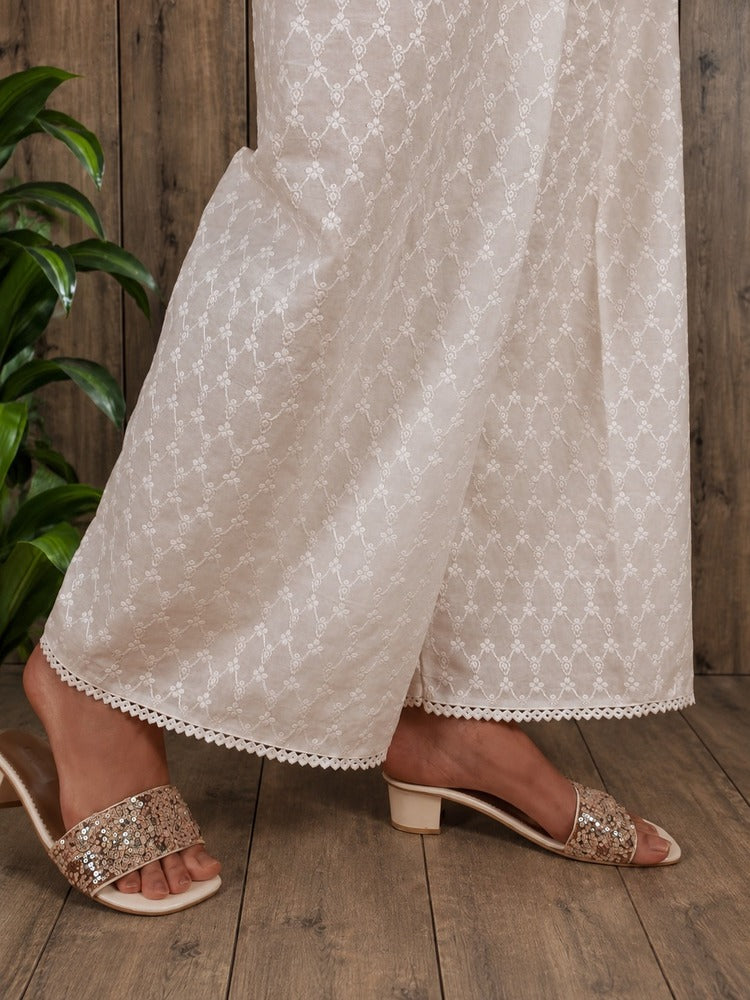 a model wearing embroided chikankari palazo