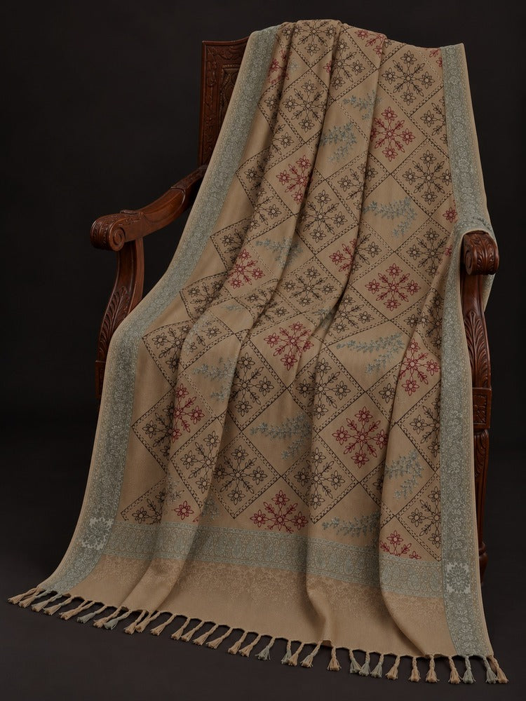 Beige shawl for women with multicoloured floral embroidery, diamond patterns, sage-grey borders and decorative tassels.