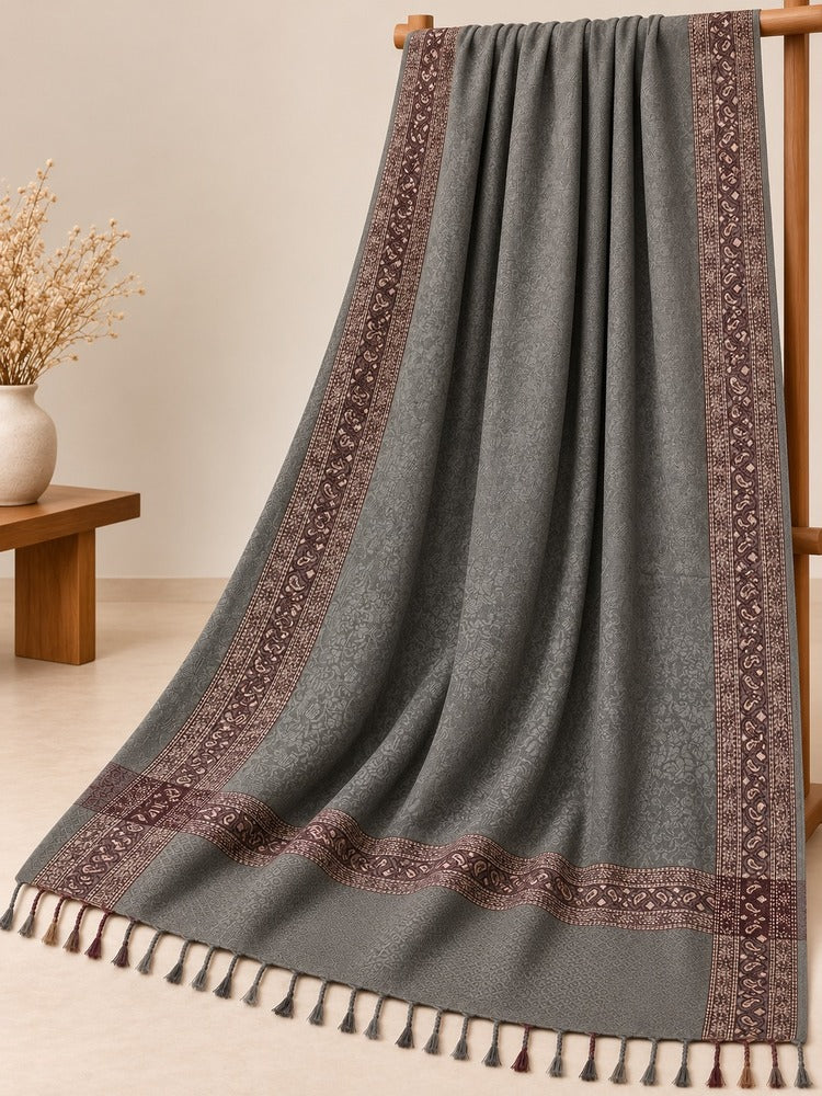 Grey winter shawl for women with maroon patterned border and decorative tassels