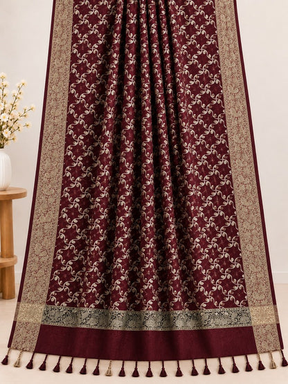Maroon embroidered winter shawl with golden threadwork, ornate patterned borders and matching decorative tassels.