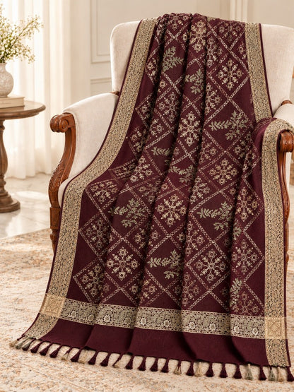 Maroon embroidered winter shawl with diamond-shaped floral motifs, olive-gold detailing, ornate borders and tassel edging.