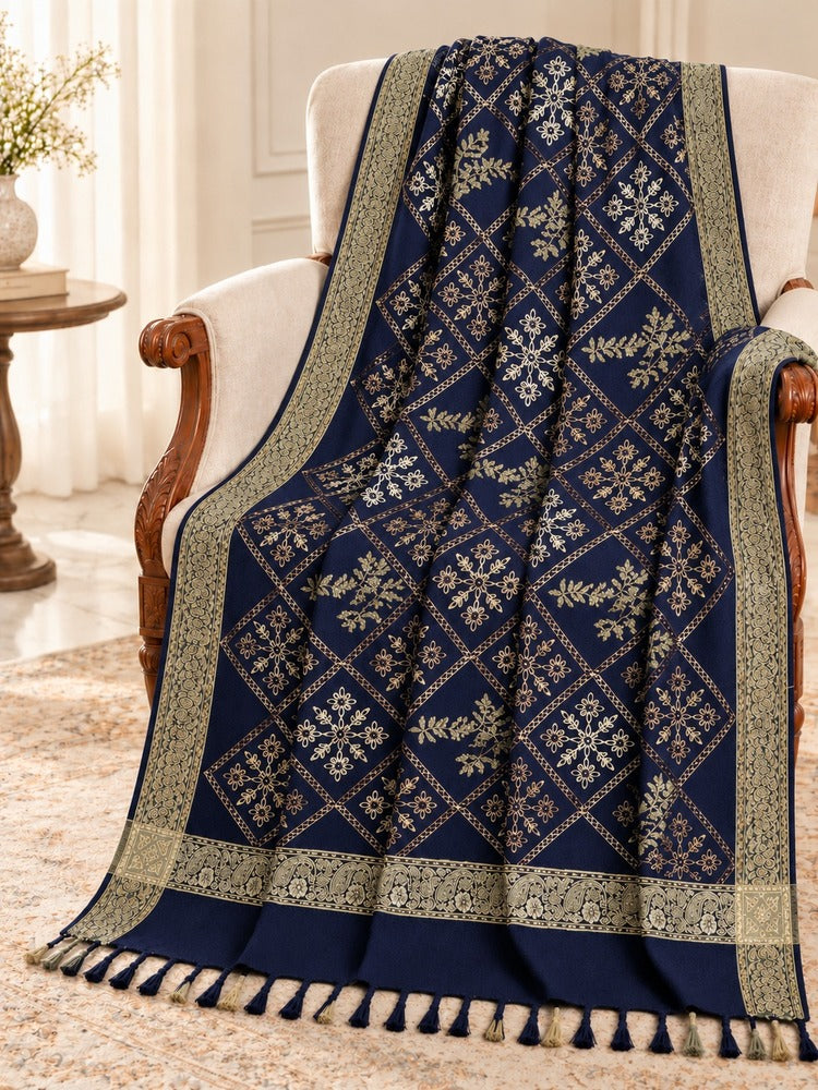 Navy shawl for women with gold-toned diamond embroidery, floral and leafy motifs, ornate borders and matching tassels.