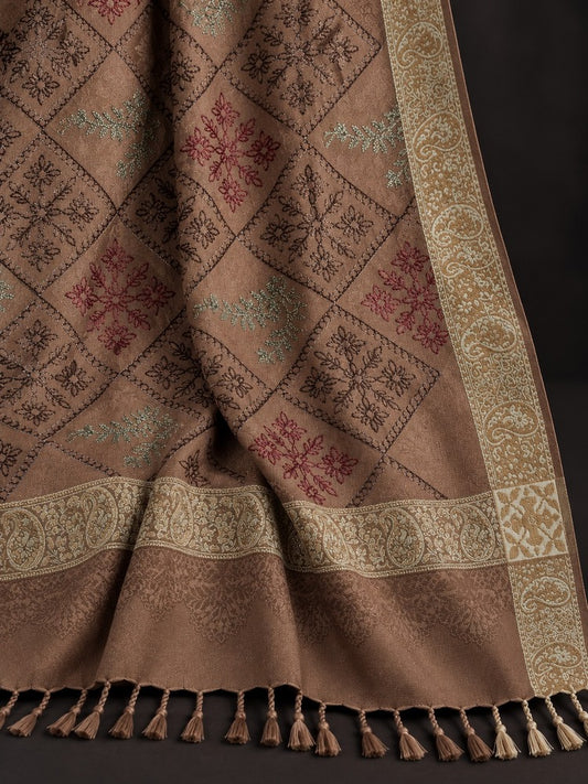 Taupe-brown winter wrap with multicoloured floral diamond embroidery, ornate beige-gold borders and decorative tassels.