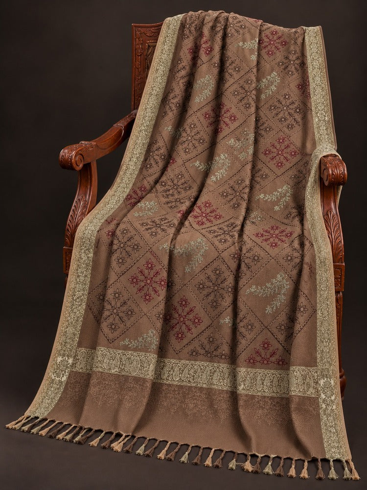 Taupe-brown winter wrap with multicoloured floral diamond embroidery, ornate beige-gold borders and decorative tassels.