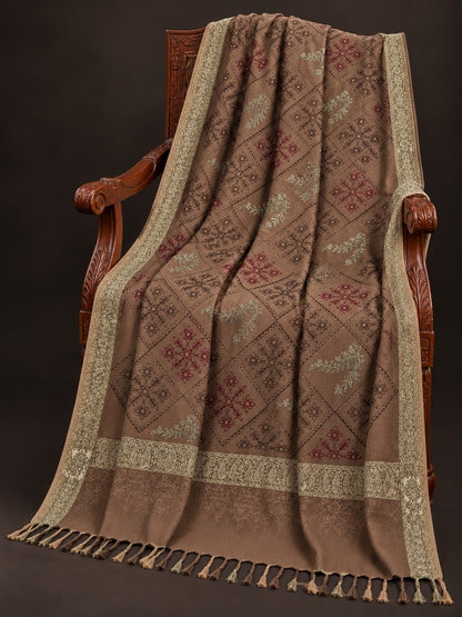 Taupe-brown winter wrap with multicoloured floral diamond embroidery, ornate beige-gold borders and decorative tassels.