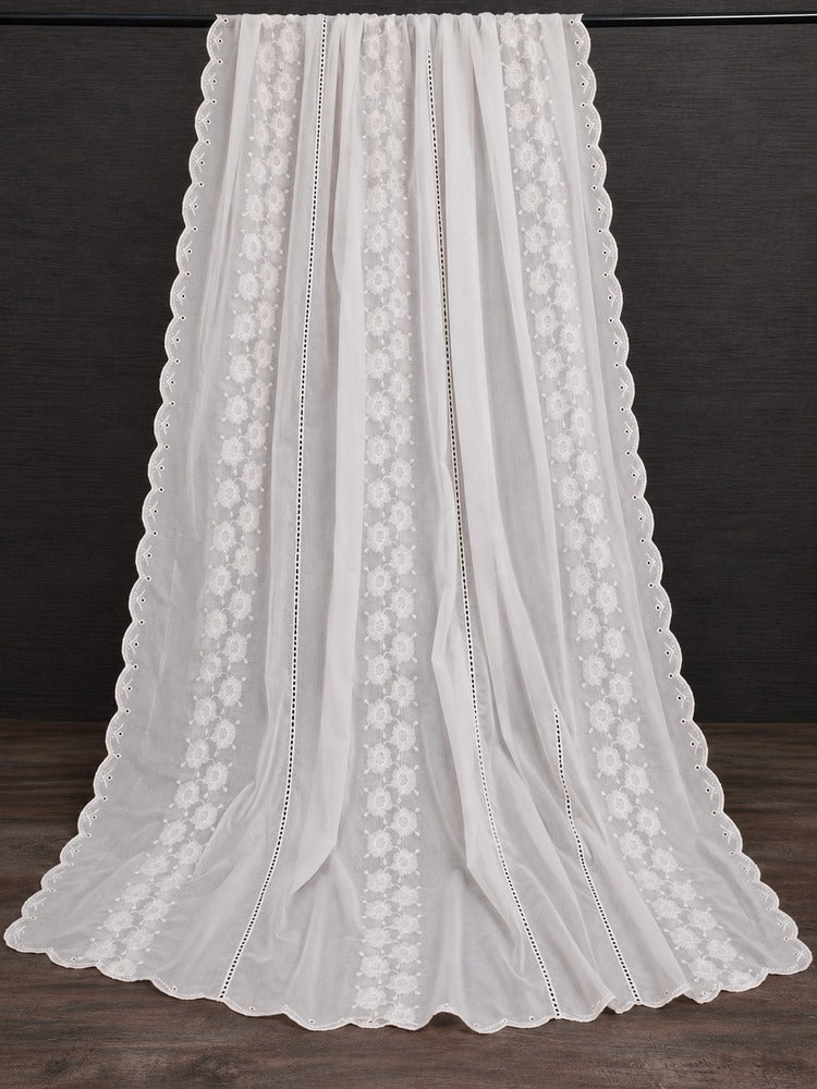 White shawl for women with delicate floral embroidery and scalloped lace edges on a dark background.